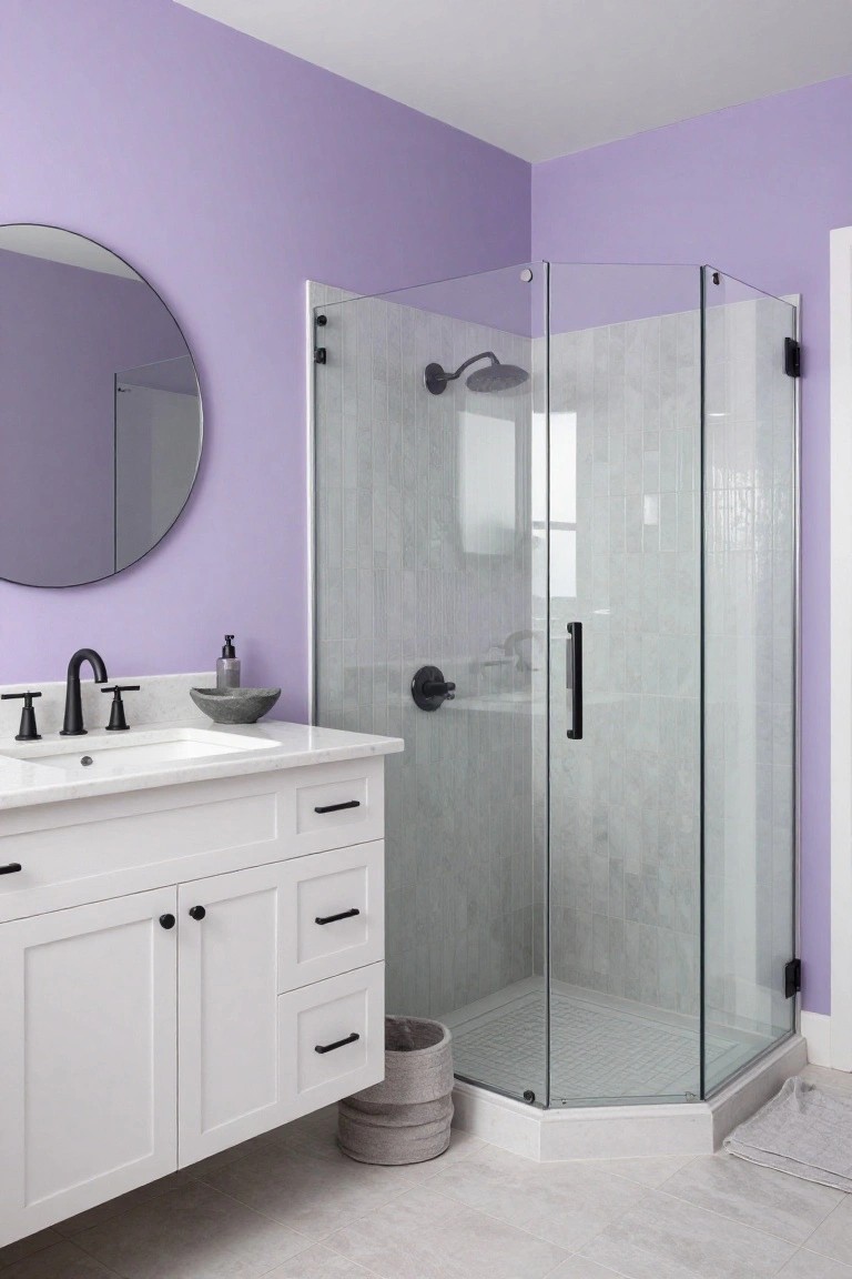 Bathroom with pale lavender walls, white vanity, and glass shower.